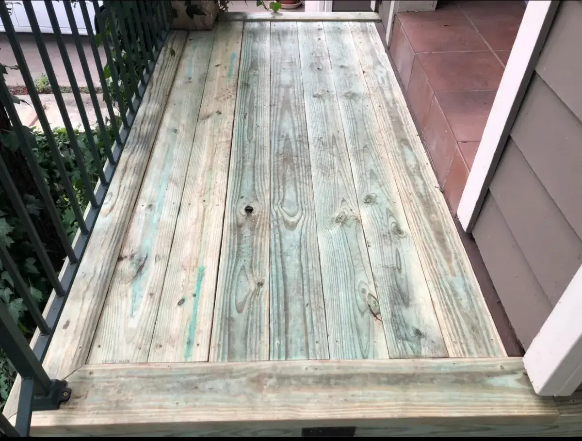 Freshly replaced pressure-treated deck boards