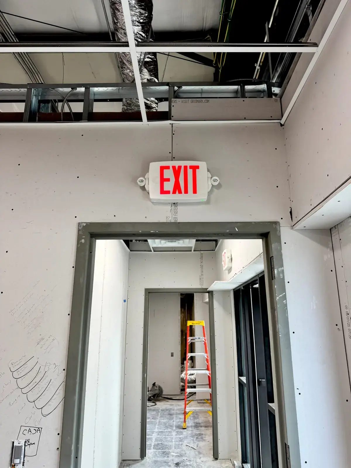 Illuminated exit sign and emergency lighting