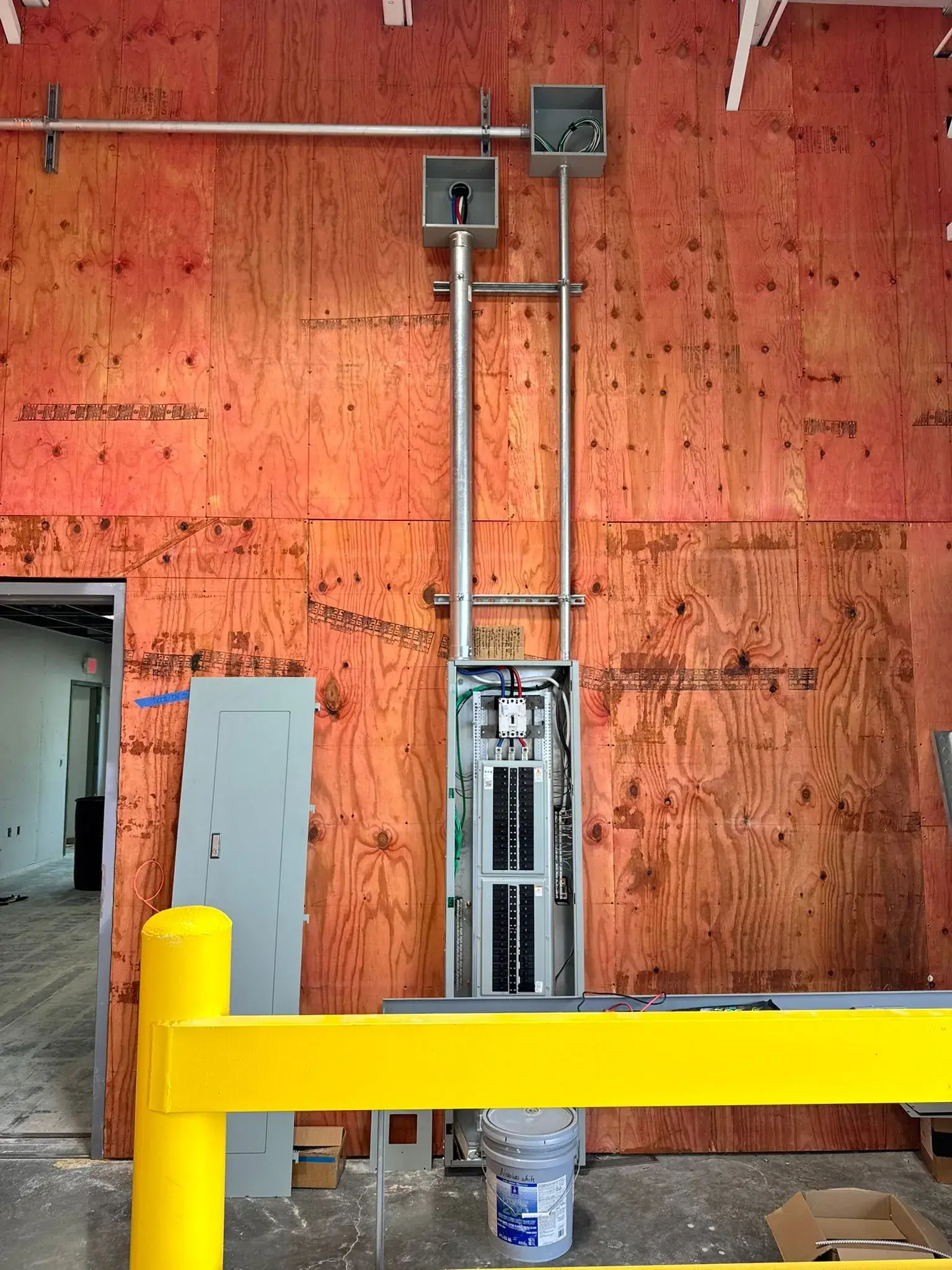 Clean electrical panel installation with conduit