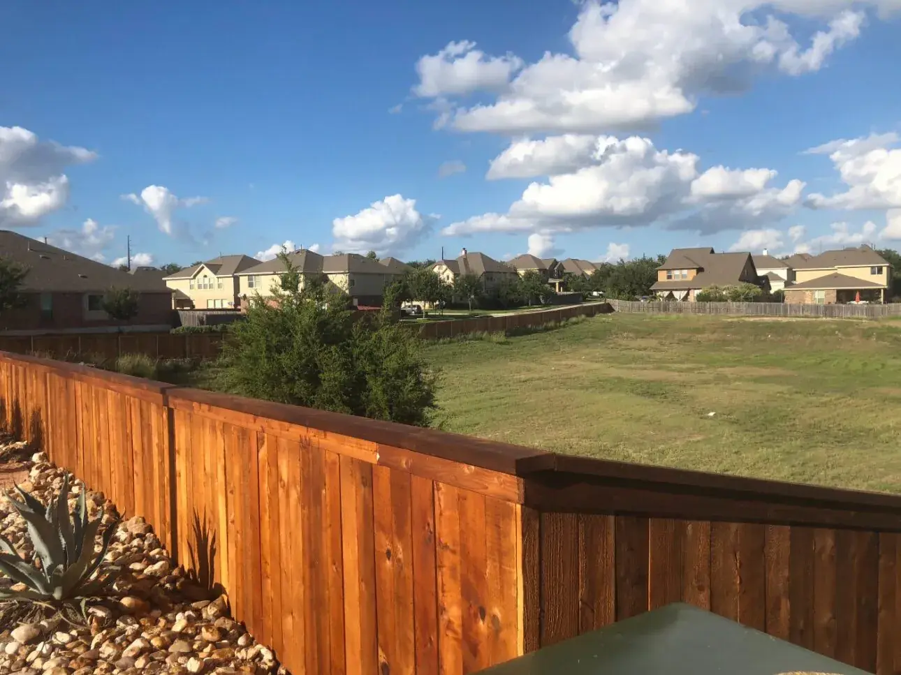 Cedar privacy fence with a hillside view