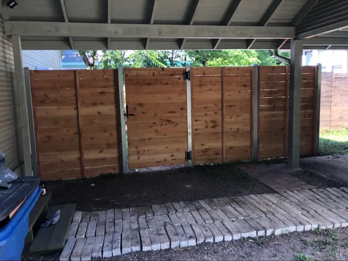 Horizontal cedar fence with a matching walk gate